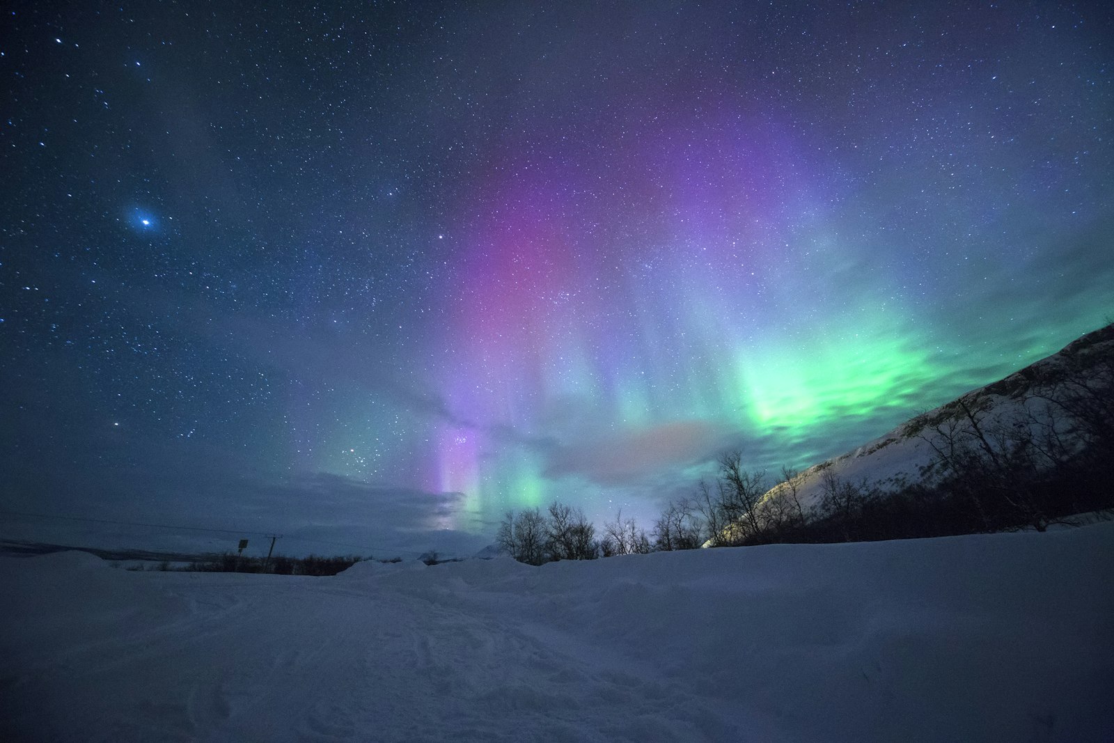 Northern lights over Norwegian landscape